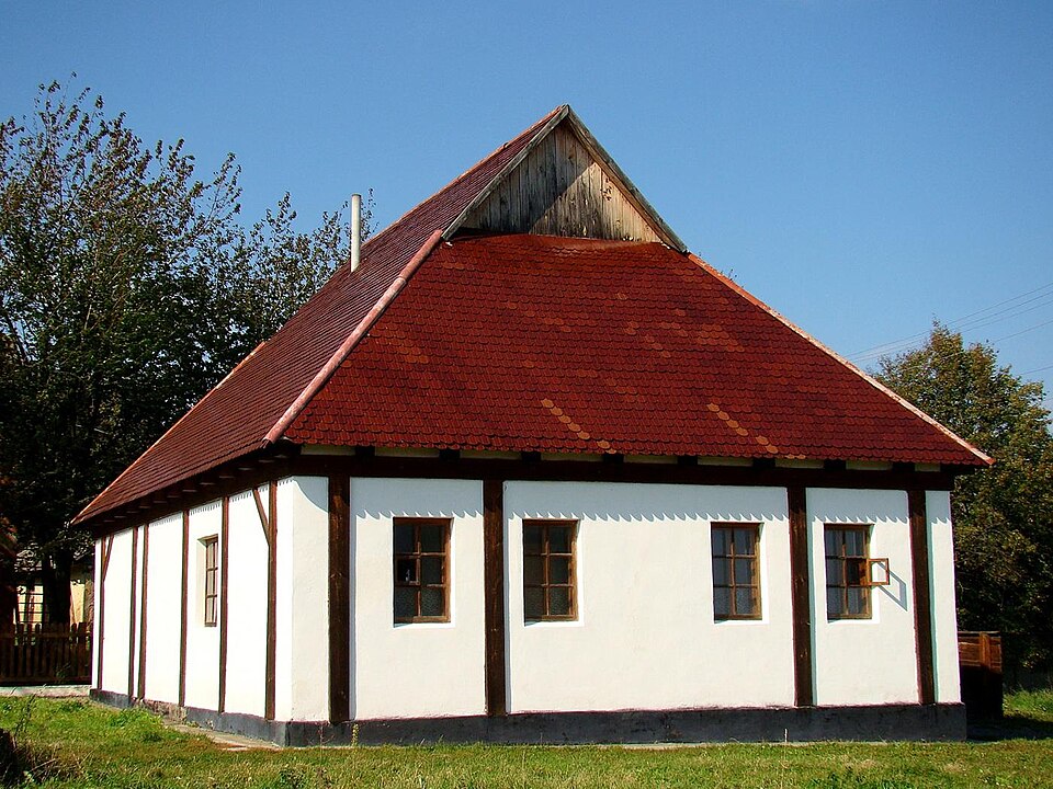The Baal Shem Tov's synagogue in Medzhybizh, Ukraine - a plain plastered building with arched windows, restored on the site where Hasidism began