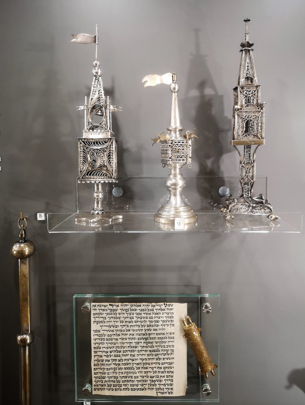 A display of Jewish ritual objects in Bielsko-Biala, including spice containers used for Havdalah.